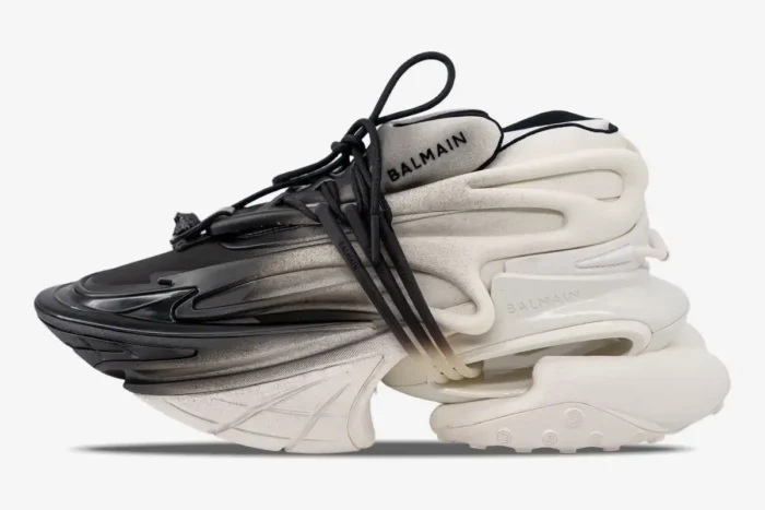 Balmain Unicorn Low Top sneakers in white and black gradient, shown from a side profile view. - SKU YM0VJ309KNED-GAB