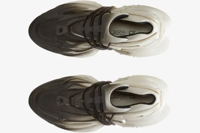 Top-down view of Balmain Unicorn Low Top sneakers in a white and black gradient with futuristic sculptural soles. - SKU YM0VJ309KNED-GAB