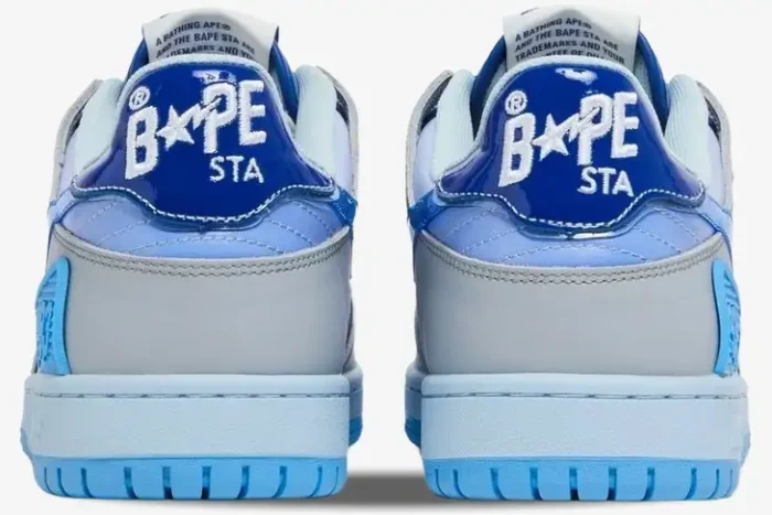 Rear view of A Bathing Ape Sk8 Sta M1 sneakers in blue and grey with BAPE STA heel branding. - SKU 1I30191003-BLU