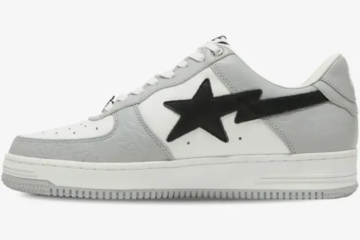 Side profile of A Bathing Ape Bape SK8 Sta sneaker in white and grey with embossed camo and black star. - SKU 1H70191002-WHT