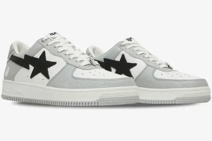 A Bathing Ape Bape SK8 Sta sneakers in white and grey with black star logo, three-quarter side view. - SKU 1H70191002-WHT