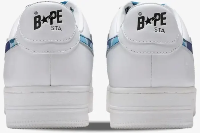 Rear view of white A Bathing Ape BAPE STA sneakers with blue ABC camo and black logo on the heel. - SKU 1H20191045-BLU