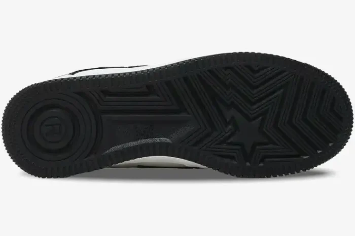 Bottom view of the black outsole of A Bathing Ape Bape Sta Low sneaker featuring a star tread pattern. - SKU 1H70191001-BLK