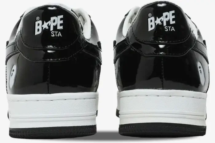 Rear view of Bape Sta Low sneakers in black patent leather with white midsoles and BAPE STA logo on the heel. - SKU 1H70191001-BLK