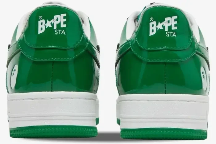 Rear view of green patent leather Bape Sta Low sneakers featuring white BAPE STA logo on heel tabs. - SKU 1H70191001-GRA