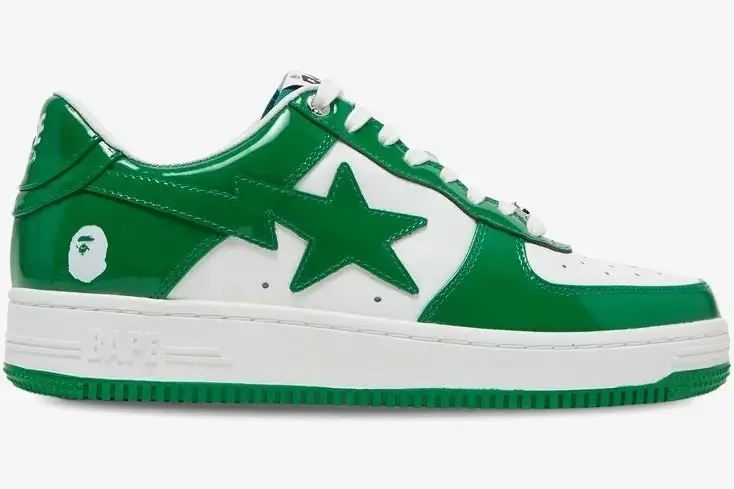 bape-sta-low-green-patent-leather-side-view-1h70191001-gra-056-549 A Bathing Ape Bape Sta Low sneaker in green patent leather and white, shown from a side profile view. - SKU 1H70191001-GRA