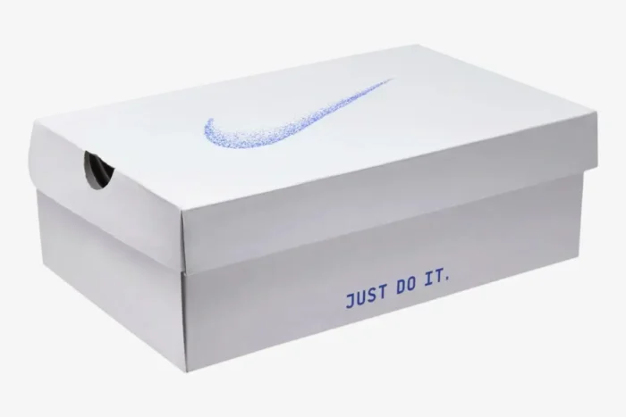 White Nike Air Zoom Alphafly Next% 3 shoebox with blue speckled swoosh and Just Do It text, perspective view. - SKU HF7357-100