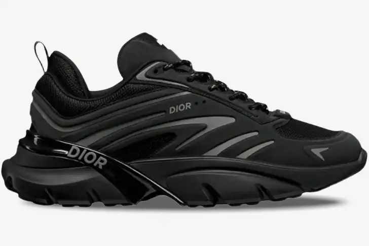 christian-dior-b44-blade-sneaker-black-side-view-3sn306zzy--812-867 Side profile of a Christian Dior B44 Blade sneaker in black with grey accents and chunky sole. - SKU 3SN306ZZY