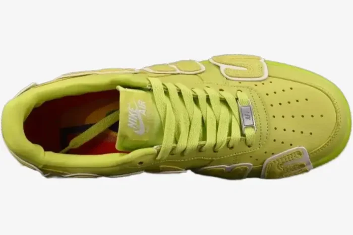 Top-down view of a lime green Cactus Plant Flea Market x Nike Air Force 1 sneaker with large side lettering. - SKU FN0255-300