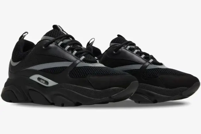 Dior B22 'Black Silver Reflective' luxury sneakers in a three-quarter side view showing mesh and leather details. - SKU 3SN231ZNG_H969
