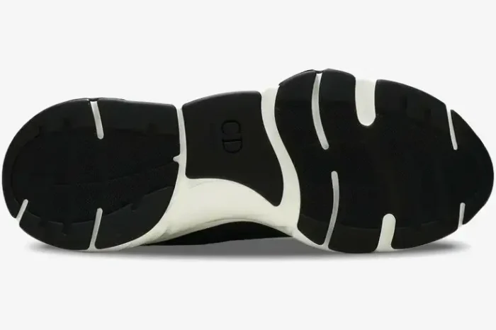 Bottom view of Dior B22 Black sneakers showing the sculpted black and white rubber outsole with CD logo. - SKU 3SN231YKB_H969