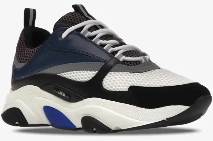 Dior B22 'Blue Grey' Navy Mesh and Calfskin Sneaker in a side profile view with white, black, and blue accents. - SKU 3SN231YKB_H560