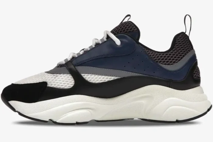 Side view of Dior B22 Blue Grey sneaker in navy mesh and calfskin with a chunky white sole. - SKU 3SN231YKB_H560
