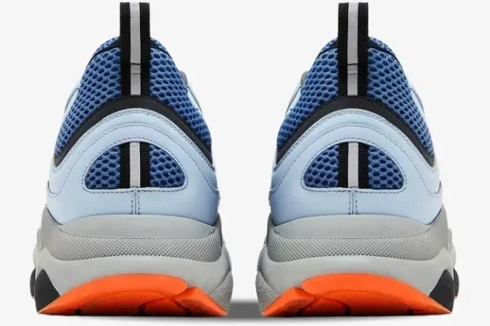 Rear view of Dior B22 sneakers in blue technical mesh, light blue, grey, and orange colorway. - SKU 3SN231YKA_H061