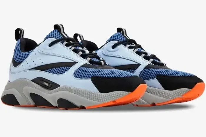 Dior B22 sneakers in blue technical mesh, light blue, grey, and orange, three-quarter side view. - SKU 3SN231YKA_H061