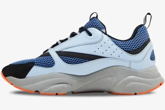 Side profile of Dior B22 sneaker in light blue technical mesh with grey and orange accents. - SKU 3SN231YKA_H061