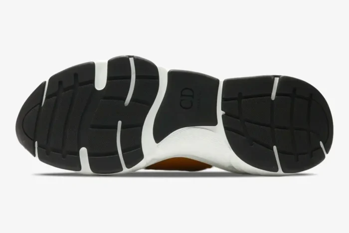 Underside view of the Dior B22 Ebony Green sneaker showing the black and white rubber sole with CD logo. - SKU 3SN231YRK_H766