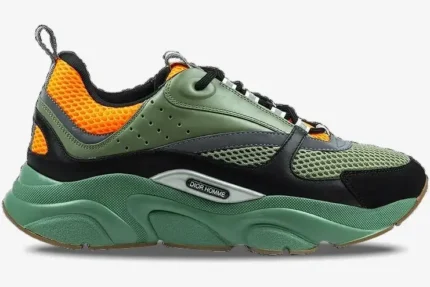 Side profile of Dior B22 luxury sneakers in orange, olive green, and black with a chunky green sole. - SKU 3SN231YKC_H663