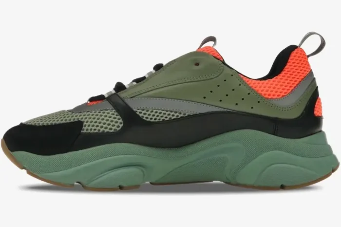 Dior B22 luxury sneakers in orange, olive, and black, featuring a chunky green sole in a side view. - SKU 3SN231YKC_H663