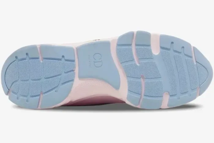 Bottom view of a Dior B22 sneaker in pink and light blue, showing the textured rubber outsole and CD logo. - SKU 3SN231ZRY_H400