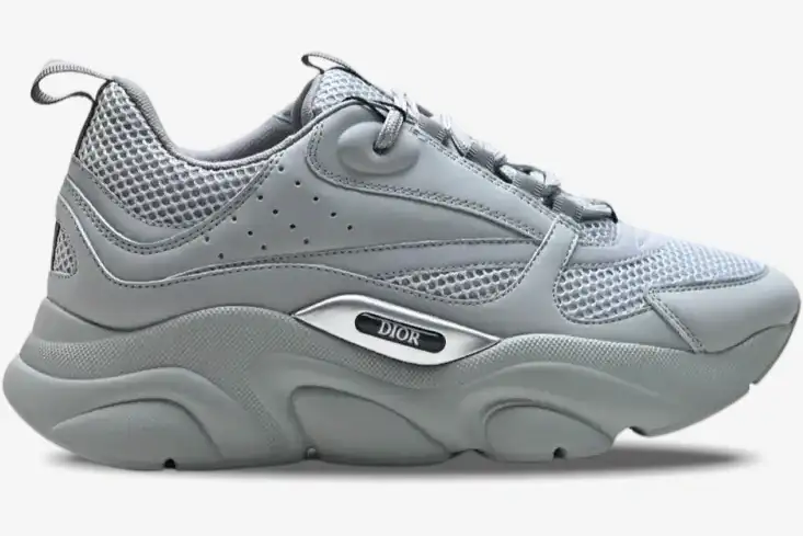 dior-b22-triple-grey-sneaker-side-view-3sn231yka804-187-728 Side profile of a Dior B22 'Triple Grey' luxury sneaker featuring mesh and leather panels. - SKU 3SN231YKA804