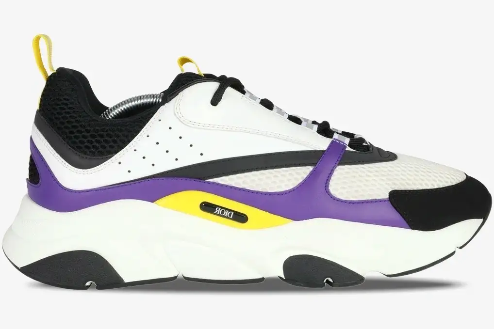 dior-b22-violet-white-sneaker-side-view-3sn231yka-h065-537-20260109_223844 Side profile of a Dior B22 sneaker in violet, white, and black with yellow accents on a chunky sole. - SKU 3SN231YKA_H065