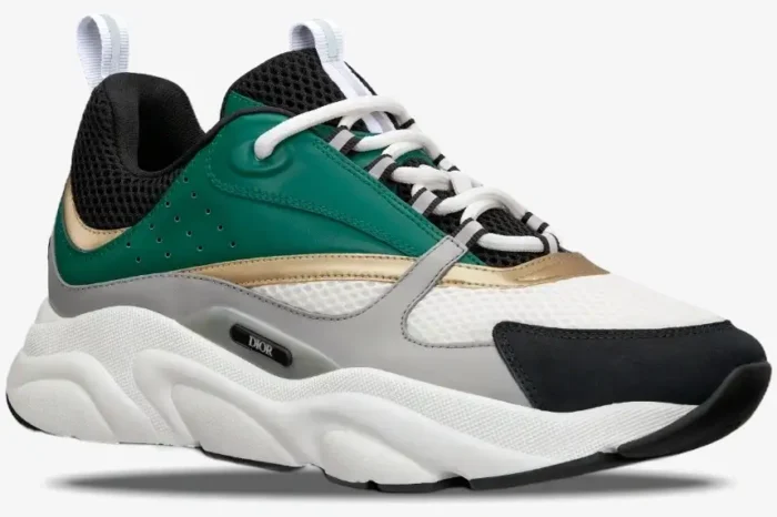 Dior B22 luxury sneaker in white, black, green, and gold, shown from a side profile perspective. - SKU 3SN231ZTA_H668
