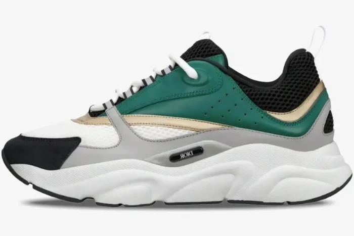 Dior B22 luxury sneaker in white, black, green, and gold seen from a side profile perspective. - SKU 3SN231ZTA_H668