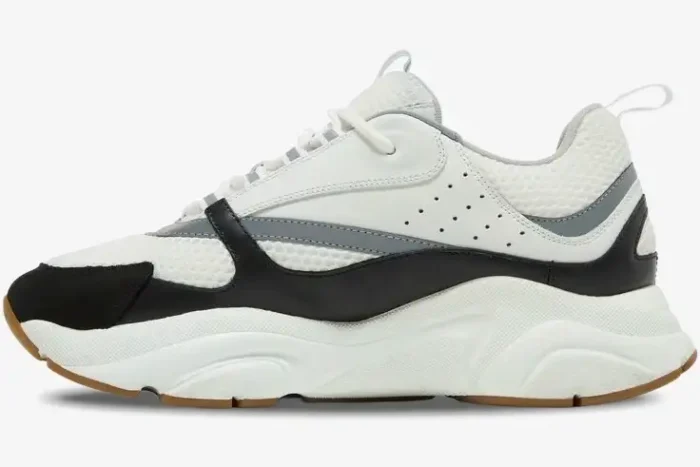 Dior B22 luxury chunky sneaker in white and black, shown from a side profile view. - SKU 3SN231YKB_H968