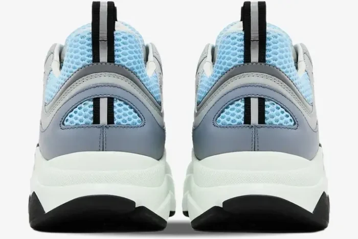 Rear view of Dior B22 luxury sneakers in white and light blue with thick soles. - SKU 3SN231YXX_H865