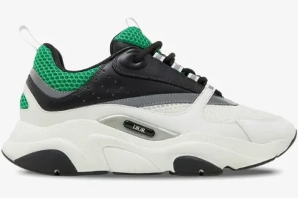 Side profile of a Dior B22 sneaker in white, black, and green with a chunky sole. - SKU 3SN231YKA_H066