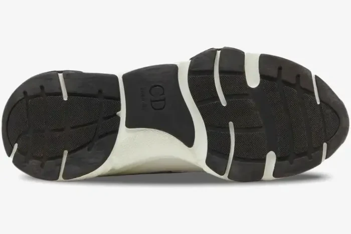 Bottom view of a Dior B22 White Green sneaker showing the black and white textured outsole with CD branding. - SKU 3SN231YKA_H066