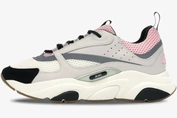 Side view of Dior B22 sneaker in white, grey, and pale pink with black accents and chunky sole. - SKU 3SN231YKB_H069