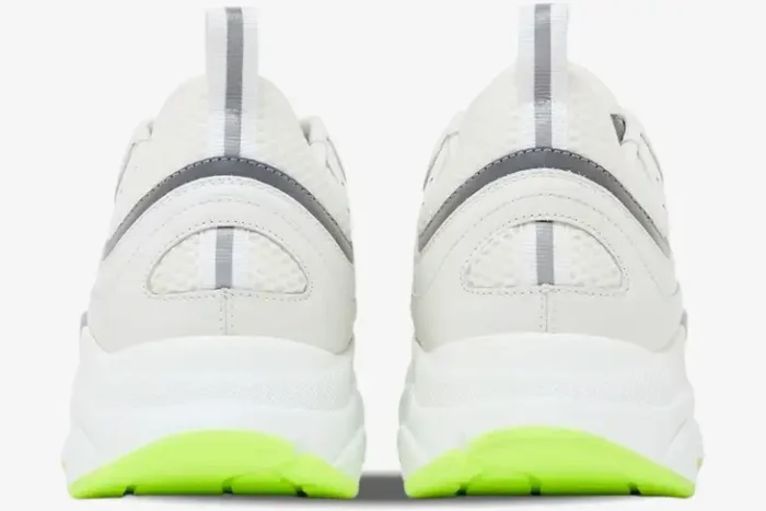 Rear view of Dior B22 sneakers in white and silver with fluorescent green outsoles. - SKU 3SN231YKA_H000