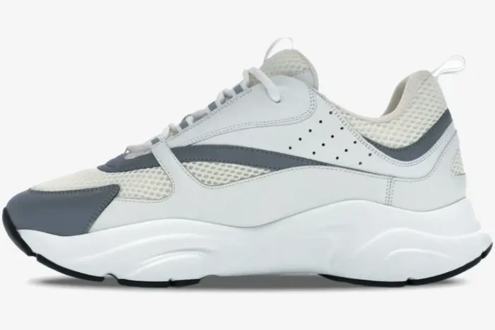 Side profile of Dior B22 'White Silver' luxury technical sneakers with mesh and leather panels. - SKU 3SN231YJG_H000