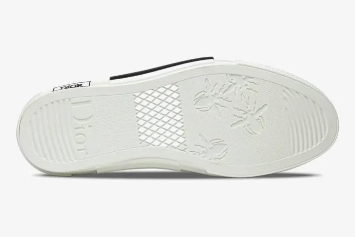 Bottom view of the Dior B23 High sneaker in transparent white, showing the white rubber outsole with bee motifs. - SKU 3SH129ZOO_H060