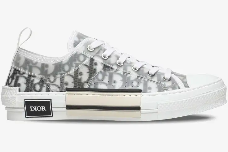 dior-b23-low-top-oblique-white-grey-side-3sn249yjp-h069 Side view of Dior B23 Low Top sneakers in white and grey Oblique canvas with transparent paneling. - SKU 3SN249YJP_H069