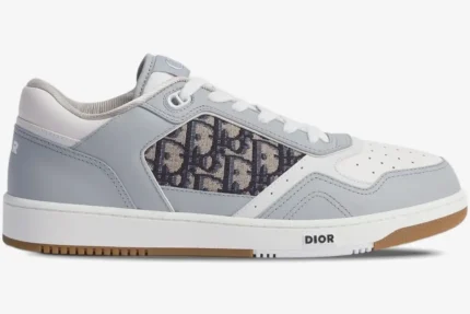 Side profile of Dior B27 Low sneakers in grey and white leather with Dior Oblique canvas panel. - SKU 3SN272ZIR_H165