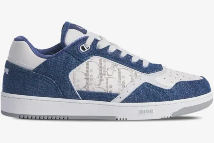 Profile view of a Dior B27 low-top sneaker in blue denim and white Oblique Galaxy leather. - SKU 3SN272ZIR_H565