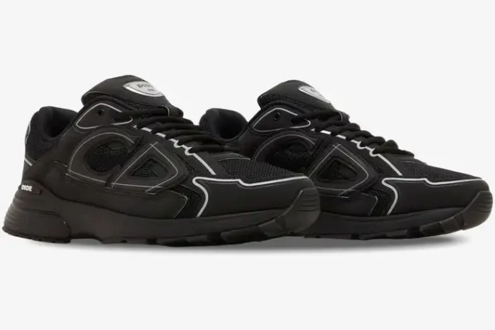 Pair of black Dior B30 mesh and technical fabric sneakers shown from a side angle. - SKU 3SN279ZRF_H900