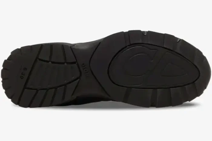 Bottom sole view of a black Dior B30 sneaker featuring the CD logo and textured tread. - SKU 3SN279ZRF_H900