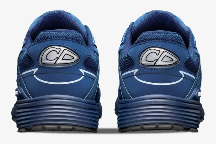 Back view of Dior B30 sneakers in deep blue mesh and technical fabric with CD logo on the heel. - SKU 3SN272ZOT_H560