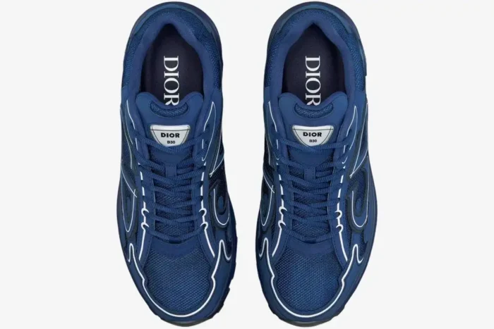 Top-down view of Dior B30 sneakers in deep blue mesh and technical fabric with white accents. - SKU 3SN272ZOT_H560