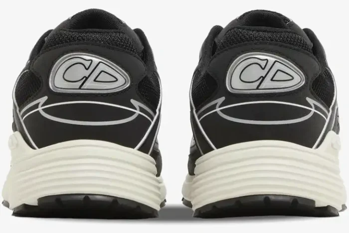 Rear view of Dior B30 sneakers in black and white mesh featuring the CD logo on the heels. - SKU 3SN279ZMB_H969