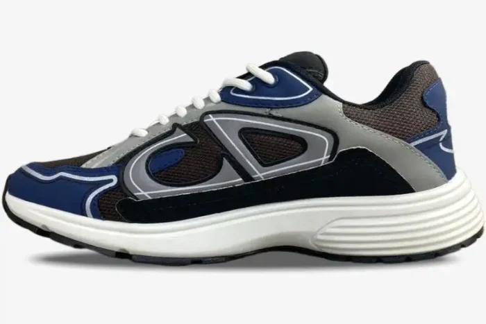 Side view of a Dior B30 sneaker in blue, grey, and black technical mesh with a white sole. - SKU 3SN279ZRB_H865