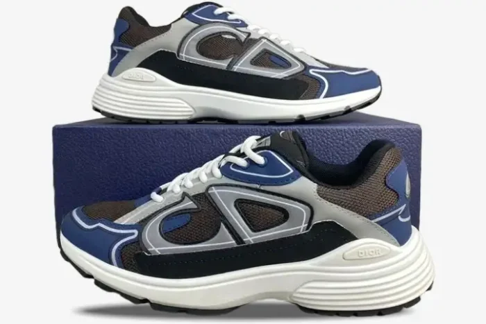 Dior B30 sneakers in blue, grey, and black technical mesh, side profile view on a blue box. - SKU 3SN279ZRB_H865