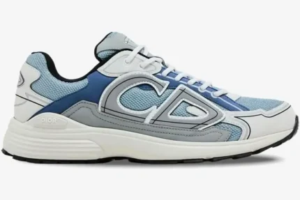 Side profile of a Dior B30 sneaker in light blue, white, and grey with a chunky sole. - SKU 3SN279ZRB_H560