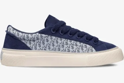 Side profile of a Dior B33 sneaker in navy blue suede and white Oblique jacquard with a thick cream sole. - SKU 3SN303ZWN_H559
