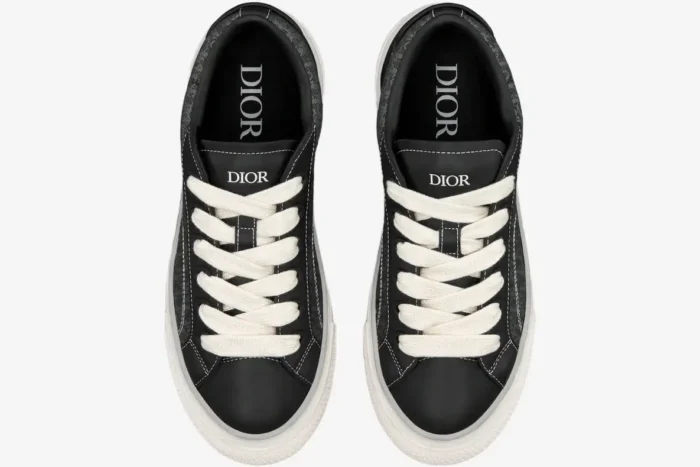 Top-down view of black Dior B33 Spin sneakers with white laces and Oblique jacquard details. - SKU 3SN303ZYS_H981