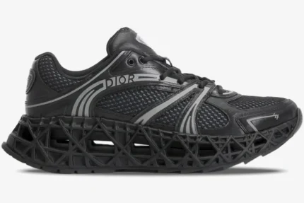 Side profile of a black Dior B35 NXXT sneaker with a 3D-printed lattice sole and mesh upper. - SKU 3SN323ZCY_H968